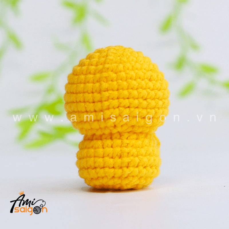 Back view of no-sew small chicken amigurumi crochet toy